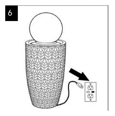 Step 6: fountain power cord being plugged into a wall outlet.